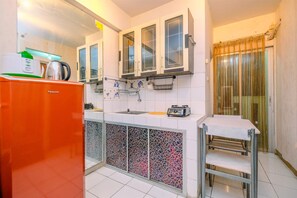 Apartment | Private kitchen - Comfort And Cozy Living 2Br At Cibubur Village Apartment (Depok)