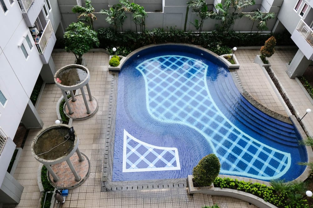 Cozy Living And Tidy 2Br At Puncak Dharmahusada Apartment