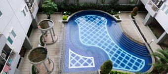 Cozy Living And Tidy 2Br At Puncak Dharmahusada Apartment