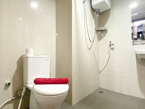 Studio | Bathroom | Shower, towels - Cozy Stay Studio Apartment at LRT City Jatibening (Bekasi)
