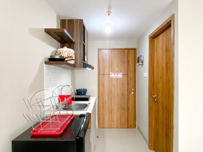Studio | Private kitchen | Full-size fridge, stovetop - Cozy Stay Studio Apartment at LRT City Jatibening (Bekasi)