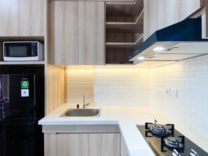 Apartment | Private kitchen | Full-size fridge, stovetop - Spacious And Homey 1Br Vasanta Innopark Apartment (Cikarang)