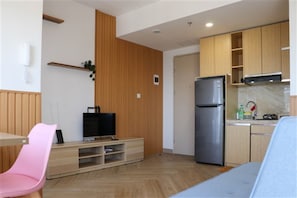 Enjoy cooking in this well-equipped kitchen with an oven, microwave, and refrigerator.