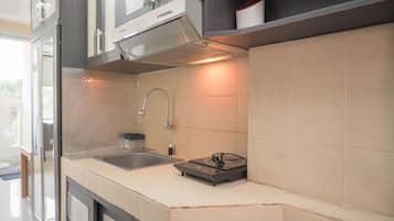 Full-sized fridge, stovetop, rice cooker, cookware/dishes/utensils