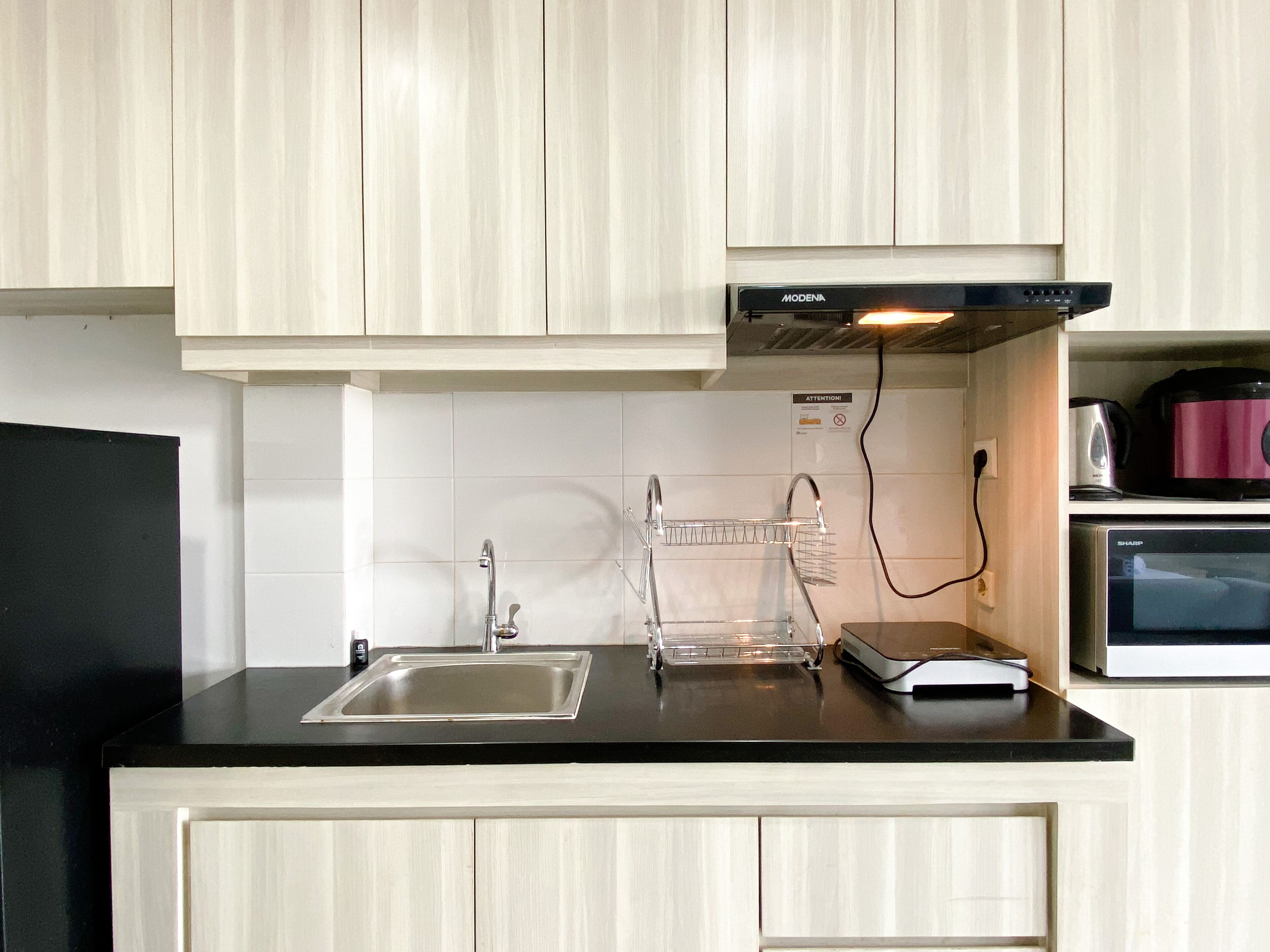 Full-sized fridge, stovetop, rice cooker, cookware/dishes/utensils