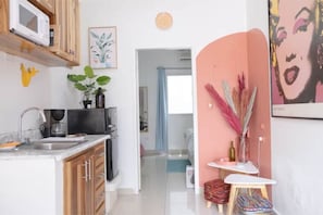 Fridge, microwave, stovetop, coffee/tea maker