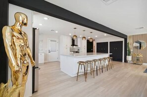 Enjoy cooking in this well-equipped kitchen with a central island and bar stools.