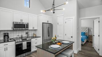 Condo, 1 King Bed | Private kitchen | Fridge, microwave, oven, stovetop