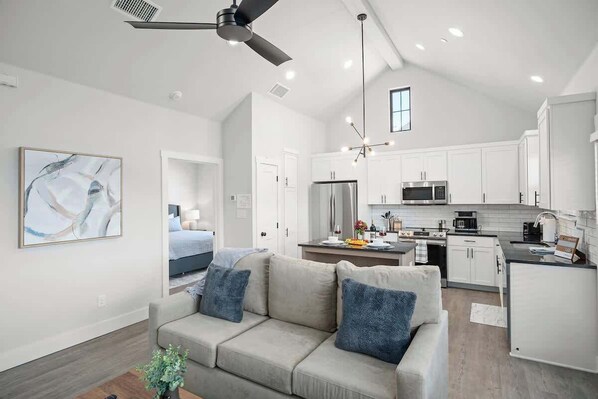Condo, 1 King Bed, Hot Tub (940 S Eagle B2 #204) | Living area | TV, fireplace