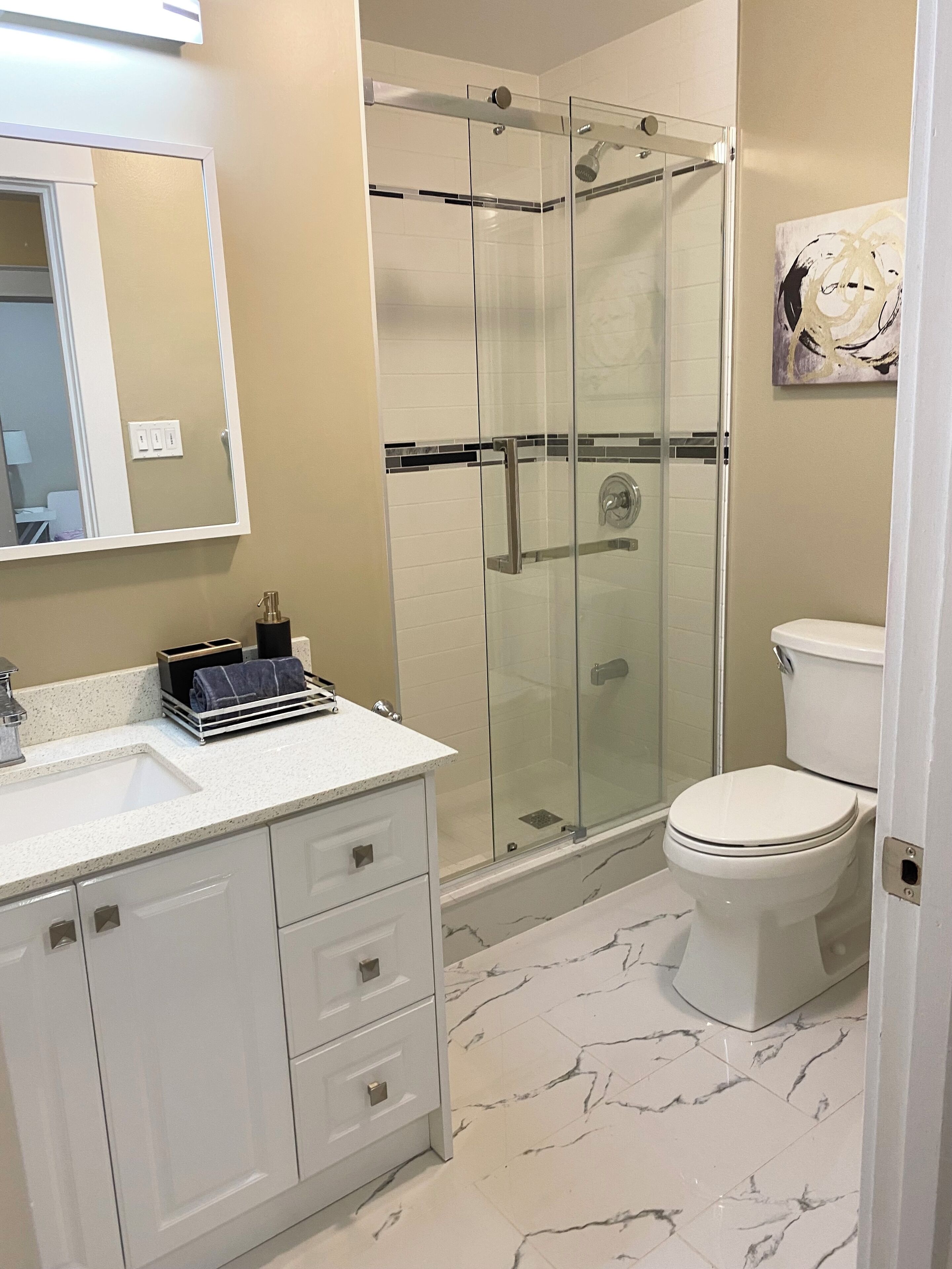 Shower, hair dryer, towels, soap