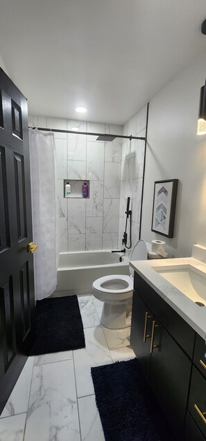 Hair dryer, towels, soap, shampoo