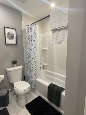 Hair dryer, slippers, towels, soap