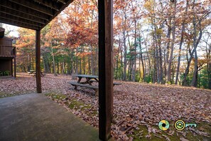 Enjoy a serene picnic amidst lush surroundings under a charming pavilion.
