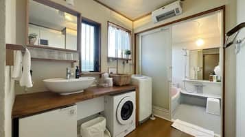 Bathtub, hair dryer, towels, soap