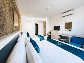 Superior Triple Room | Desk, laptop workspace, bed sheets - Rivera Boutique (Da Nang)
