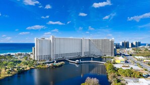 A large hotel with multiple floors, a marina, and a view of the ocean. - Remodeled Resort Condo w/ Ocean & Beach Views (Panama City Beach)