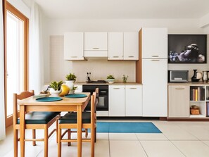 Fridge, microwave, highchair, cookware/dishes/utensils