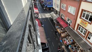 A street view with shops and buildings, including a sign for 'DR MAVI' and 'KIRALIK'. - Mahya Hotel (Istanbul)
