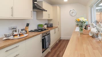 Fridge, electric kettle, toaster, cookware/dishes/utensils