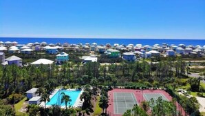A resort with multiple bungalow-style accommodations, a swimming pool, and tennis courts. - Beachfront, Pools, Pickleball, in Morgantown (Gulf Shores)