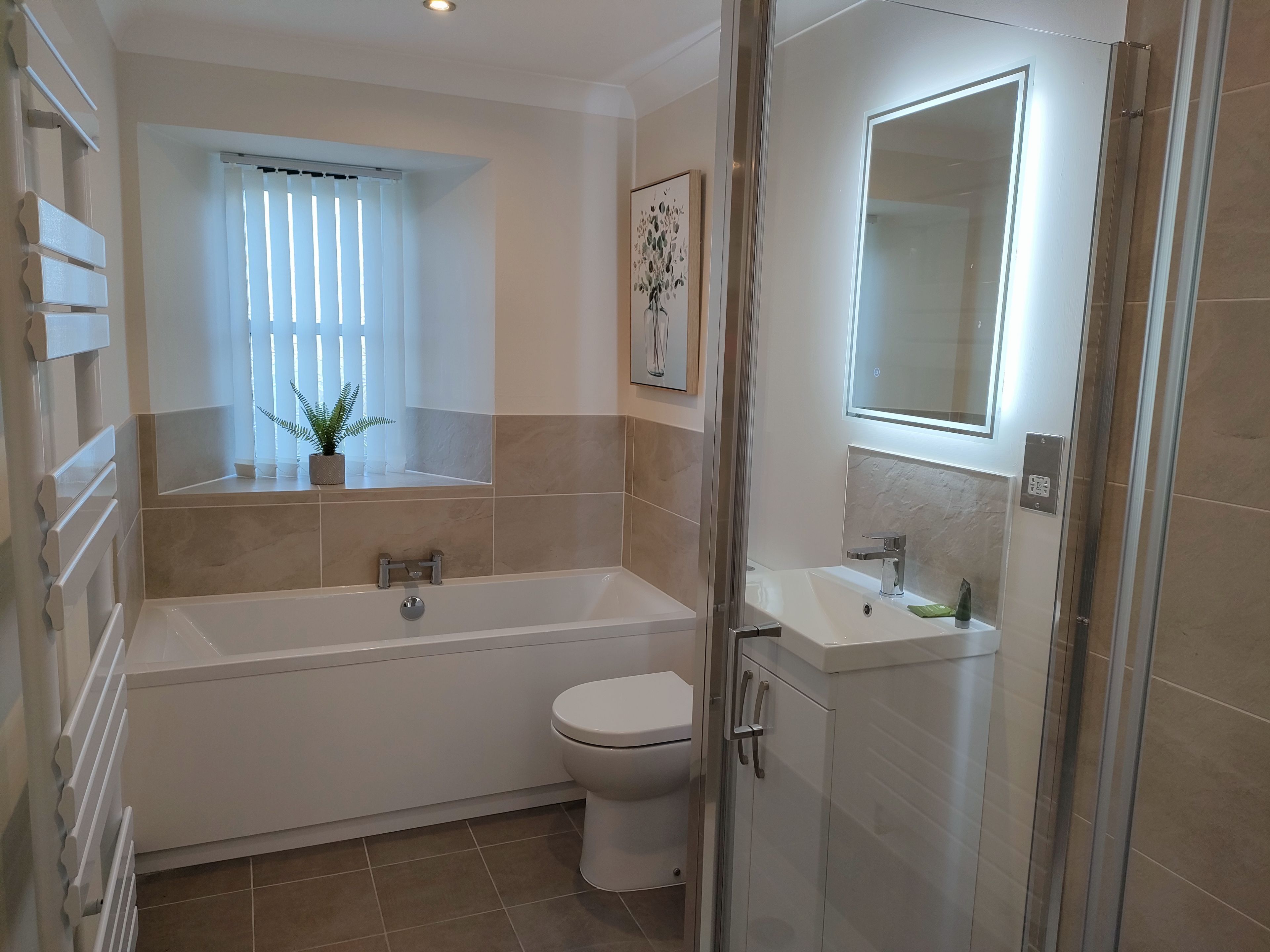 Bathtub, hair dryer, towels