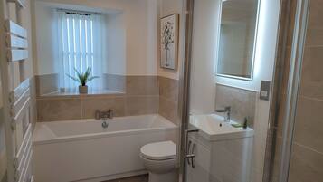 Bathtub, hair dryer, towels