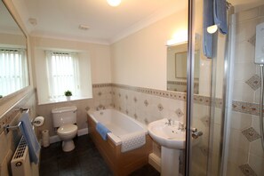 Bathtub, hair dryer, towels