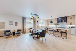 Enjoy cooking in this well-equipped kitchen with a central island, stove, and ample counter space.