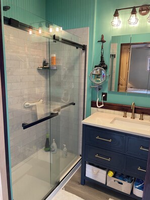 Shower, hair dryer, towels, soap