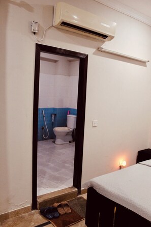 Towels, soap, shampoo, toilet paper - Stylish 2BR Unit: ideal retreatliving room kitchen  (Islamabad)