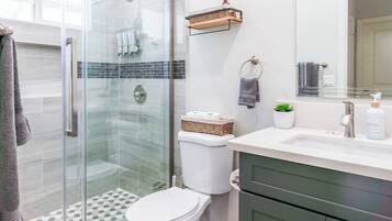 Shower, eco-friendly toiletries, hair dryer, towels
