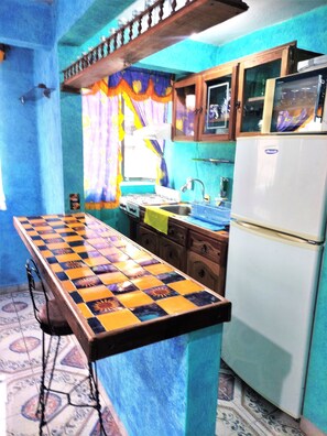 Microwave, stovetop, blender, cookware/dishes/utensils