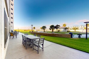 Outdoor dining - Gulf-front condo with beach access, pools, hot tub, & sports courts (Gulf Shores)