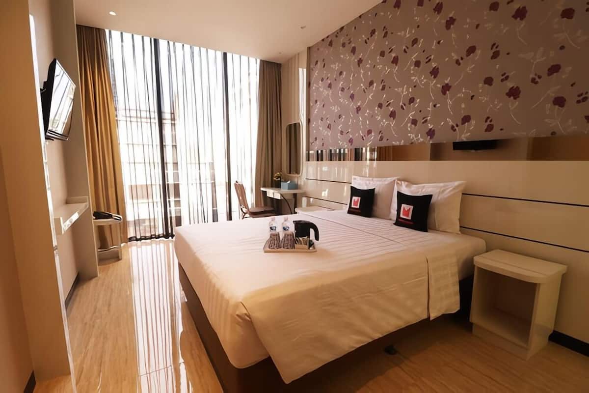 Habitación ejecutiva, 1 cama Queen size | 1 habitación, tabla de planchar con plancha, wifi gratis y ropa de cama