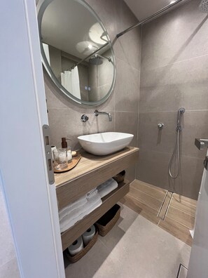 Shower, hair dryer, towels, soap