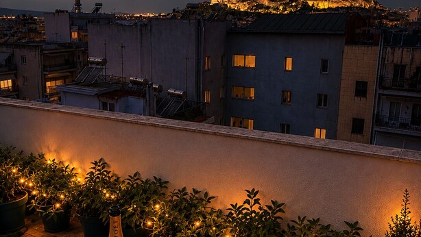 A rooftop terrace with a table set for two, a bottle of wine, and candles. - Stylish 1BR Apt. Opposite Metro- Balcony & Rooftop Lounge with Acropolis View (Athina)