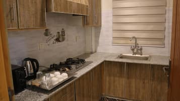 Microwave, cleaning supplies, freezer, paper towels