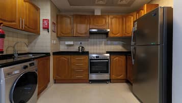 Deluxe Studio | Private kitchen | Full-size fridge, microwave, oven, electric kettle