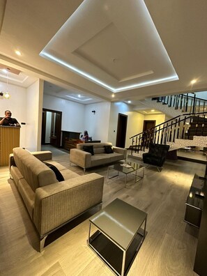 Superior Single Room, 1 Bedroom, Courtyard View, Mountainside | Living area | 72-inch Smart TV with digital channels, Netflix, streaming services - De James Hotels & Suites (Abuja)