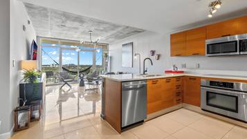 Condo, 1 Bedroom, City View | Private kitchen | Fridge, microwave, oven, stovetop