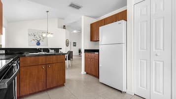 Full-sized fridge, microwave, coffee grinder, spices