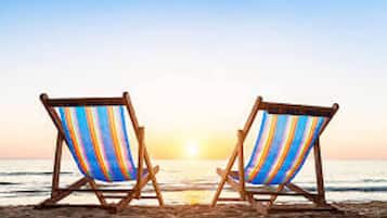 On the beach, sun loungers