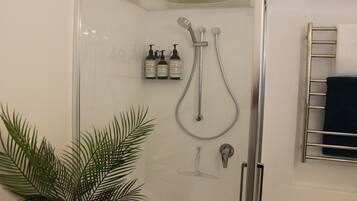 Shower, hair dryer, towels, soap