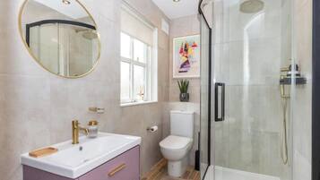 Shower, hair dryer, towels, soap