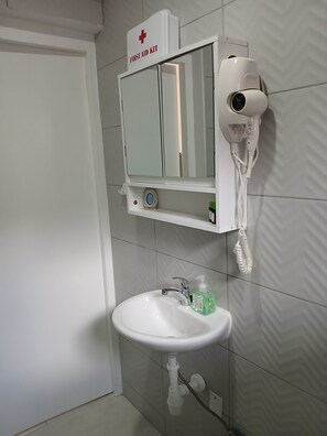 Shower, hair dryer, towels, soap
