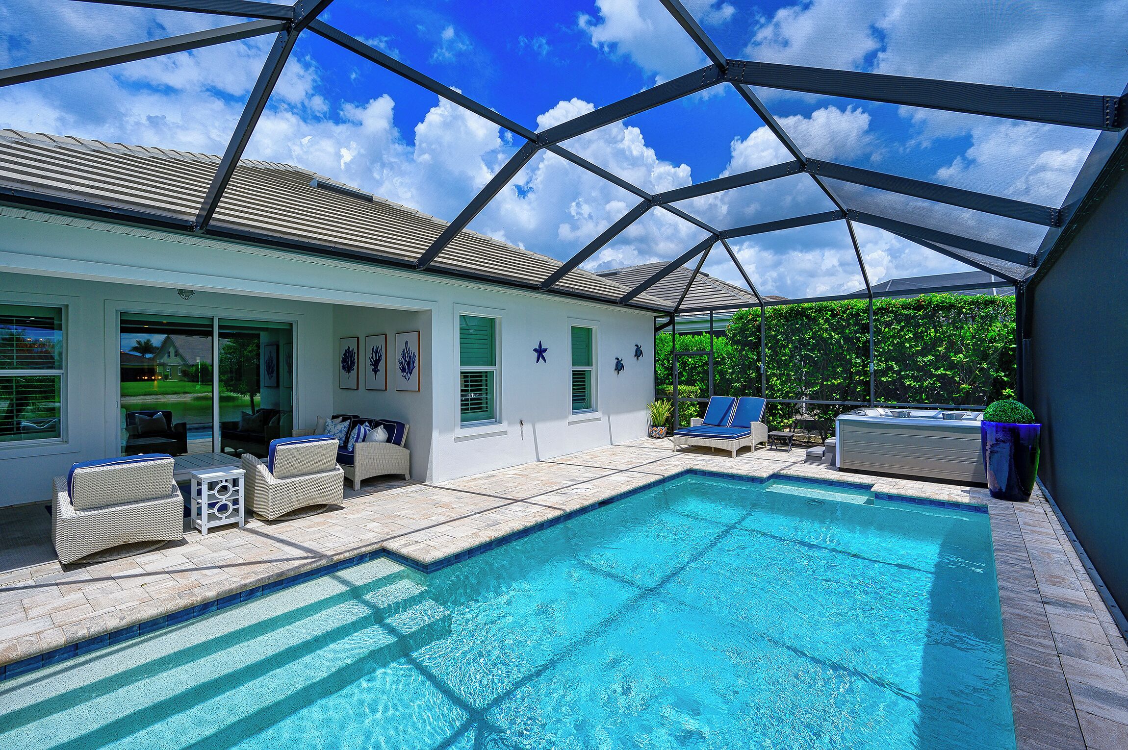 Indulge in a lavish home, heated saltwater pool, & spa, near all Naples offers.
