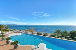 A swimming pool with a view of the sea and mountains. - Spacious Stunning Views 2-Bed Apartment, Estepona (Estepona)