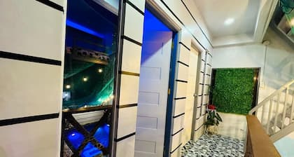 Affordable Cozy rest house with pools , free wifi and parking on site