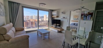 Deluxe Penthouse | Living area | 43-inch Smart TV with satellite channels