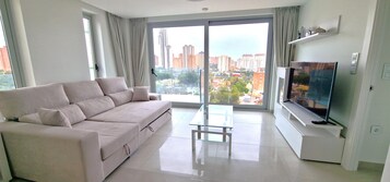 Superior Apartment | Living area | 43-inch Smart TV with satellite channels